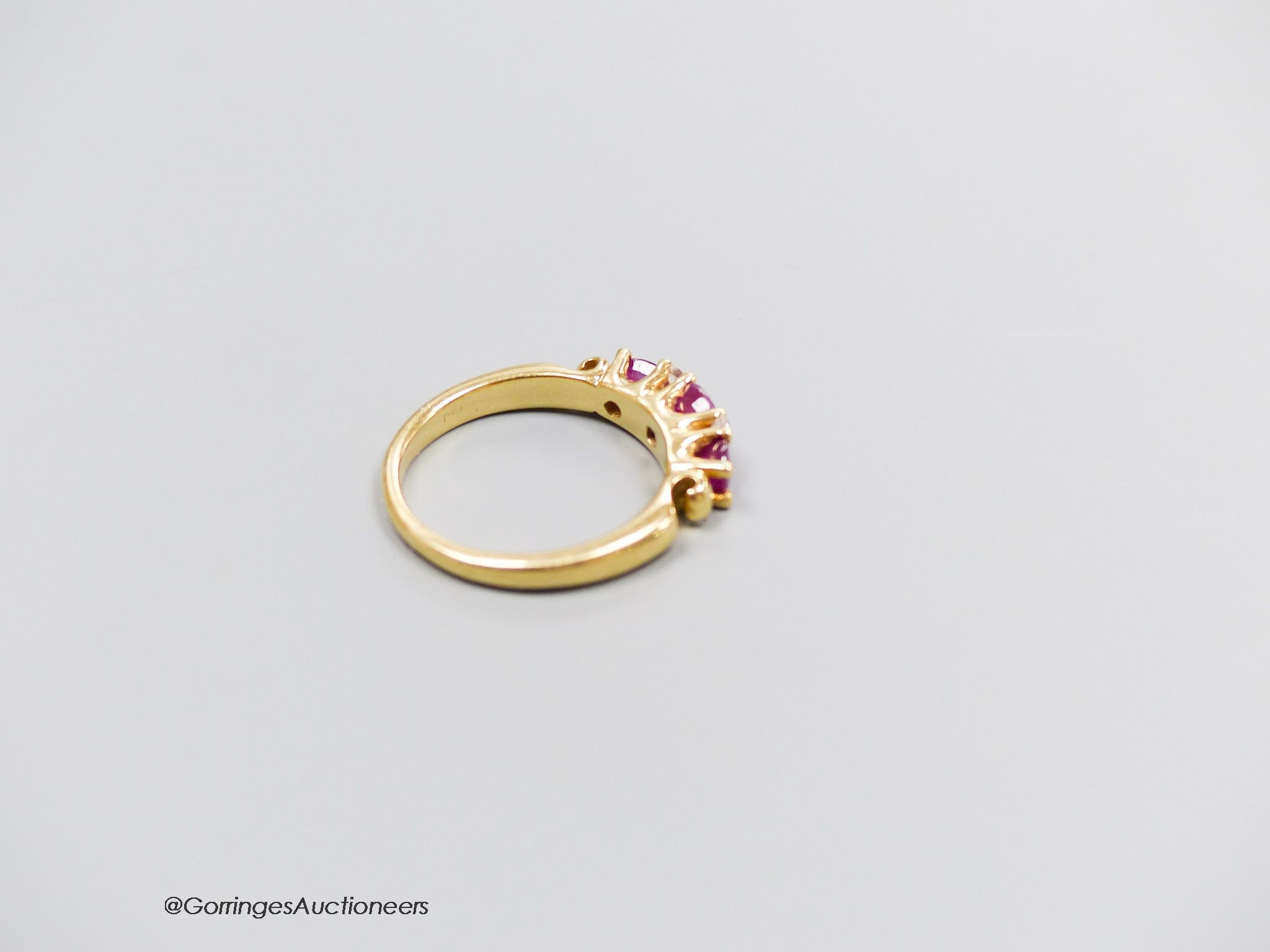 A 18ct gold ruby and diamond ring, size M, gross 5g.